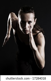 Woman Running Over Dark Background