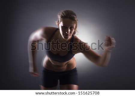 Similar – One young middle age athletic woman at crossfit training, exercising with trx suspension fitness straps over dark background, front view, looking up