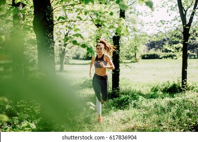 Woman Running In The Park