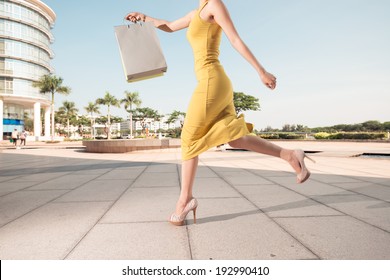 Woman Running With Shopping Bag