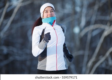 Woman Running In Winter Park