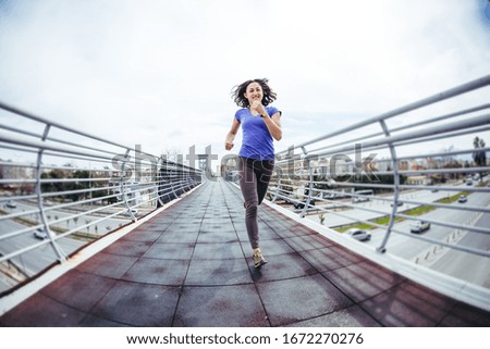 Similar – Image, Stock Photo runner running across the field with his dog