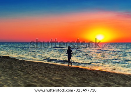 Woman runs In the Baltic Sea