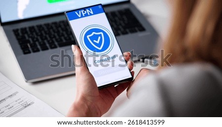 Woman Safeguarding Her Online Privacy With VPN On Her Phone. Possible Professions: Cybersecurity Analyst