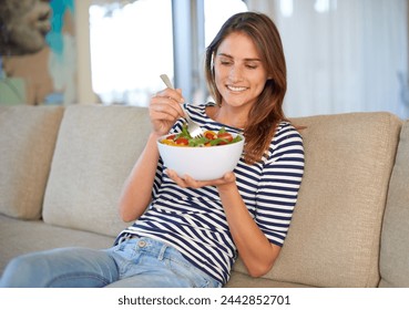 Woman, salad and smile with home, diet and health or wellness for weight loss. Lady, living room and organic vegetables with happiness, vegan snack or lunch choice on couch or lounge in house - Powered by Shutterstock