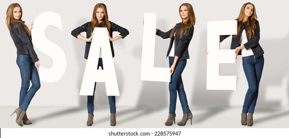 Woman with Sale letters - Shutterstock ID 228575947