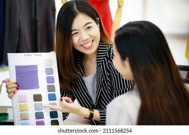 Woman Sales Representative Showing Catalog Of Fabric Color Sample To Customer With Smile, Cheerful And Energetic Action. Concept Of Professional Working And Good Relationship Among Seller And Buyer.