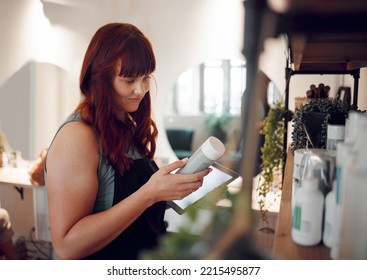 Woman in salon, product inventory on tablet and small business entrepreneur with online order in Berlin. Professional hairdresser, plastic packaging and organize beauty boutique stock with technology - Powered by Shutterstock