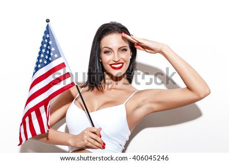 Woman salute with little USA flag, july 4th