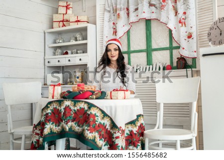 Woman in santa hat waiting for new year celebration
