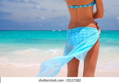 Woman With Sarong On Caribbean Beach