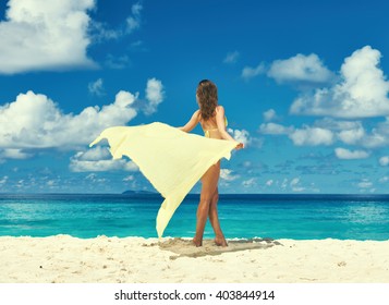 Woman With Sarong At Seychelles Beach