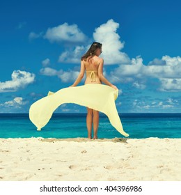 Woman With Sarong At Seychelles Beach