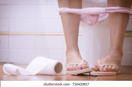 Woman Sat In The Toilet