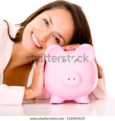 Woman saving money in a coin bank - isolated over white
