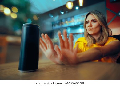 Woman Saying no to a Soda Energy Drink Full of Sugar
Girl making healthy choices refusing to drink sugary soft beverages