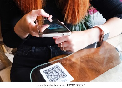 Woman Scanning The Barcode Qr Code In Restaurant Or Cafe To Order Food. Safe Conctlactless Menu, Modern Lifestyle. Focus On The Phone