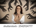 Woman scared by monstrous hands reaching for her. Creepy shadows in room