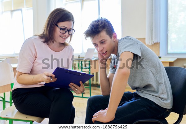Woman school psychologist\
talking and helping student, teenage boy. Mental health of\
adolescents, psychology, social issues, professional help of\
counselor