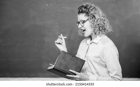 Woman school teacher in front of chalkboard. Passionate about knowledge. Pedagogue hold book and explaining information. Education concept. Teacher explain hard topic. Teacher best friend of learners