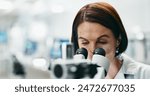 Woman, scientist and forensic with microscope for discovery, research or breakthrough at laboratory. Female person or biologist looking in scope or biotechnology for experiment, test or exam at lab