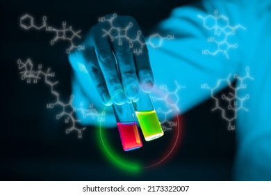 A woman scientist holding Organic chemistry sample glass vials in a laboratory - radioactive - fluorescence. A copy space black background. Organic medicinal chemistry laboratory. - Shutterstock ID 2173322007