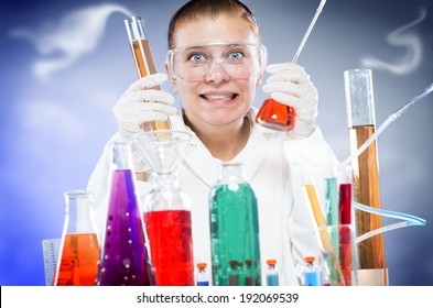 Woman Scientist In Laboratory With Glass Tubes