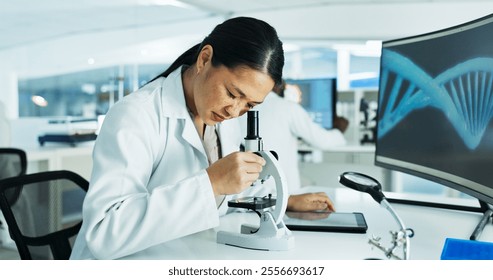 Woman, scientist and microscope at laboratory with dna sequence for medical or scientific study. Female person, employee and serious with analyzing or test bacteria, virus and clinical experiment - Powered by Shutterstock