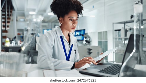 Woman, scientist and research with laptop and tablet for results, medical study or exam on new discovery at lab. Female person or biologist working on technology for experiment or test at laboratory - Powered by Shutterstock