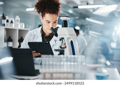 Woman, scientist and tablet with microscope in lab for experiment research, medical data or science information. Person, researcher and digital for biotechnology study, feedback and vaccine solution - Powered by Shutterstock