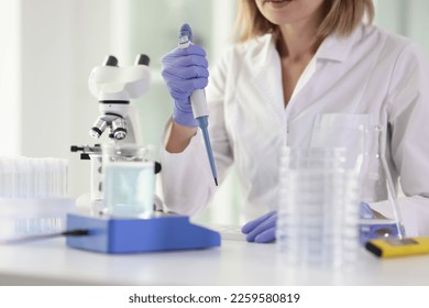 Woman scientist is working in scientific laboratory with test samples. Research, technology and science concept. - Shutterstock ID 2259580819