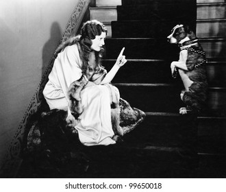 Woman Scolding Dog On Stairs