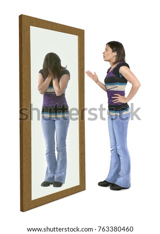 Woman scolding herself in a mirror