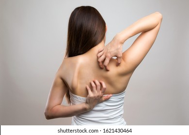 A Woman Scratching Her Back.