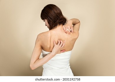 A Woman Scratching Her Back.