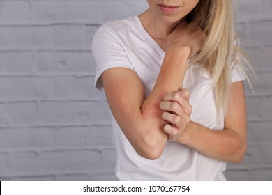 Woman Scratching an itch . Sensitive Skin, Food allergy symptoms, Irritation