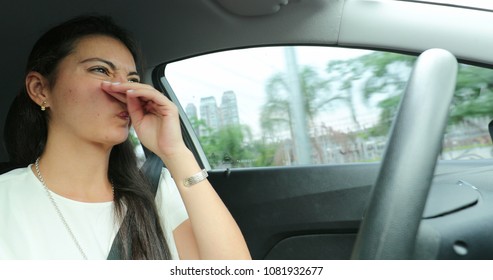 Woman Scratching Nose While Driving