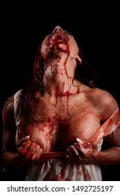Woman screaming covered in blood