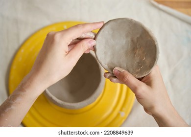 Woman Sculpting A Lid For A Clay Pot