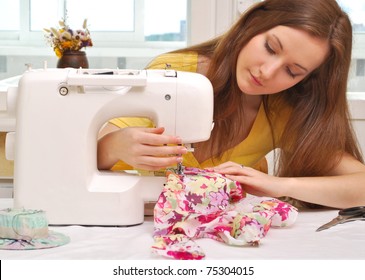 Woman seamstress work on the sewing-machine