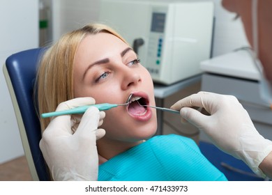Woman seeing a dentist - Shutterstock ID 471433973
