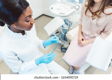 Woman Seeing Gynecologist Doctor In Her Office To Check For STD