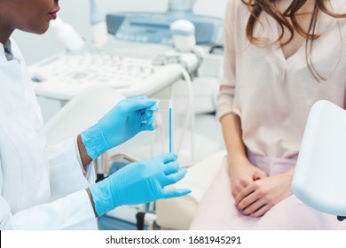 Woman Seeing Gynecologist Doctor In Her Office To Check For STD