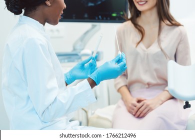 Woman Seeing Gynecologist Doctor In Her Office To Check For STD