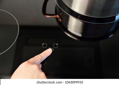 Woman select function on Induction stove