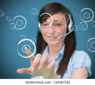 Woman selecting phone symbol from holographic digital interface - Shutterstock ID 114367126