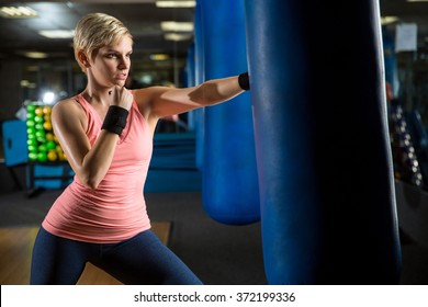 Woman In Self Defense Class Practicing Punch Kick Kickboxing Training Gym