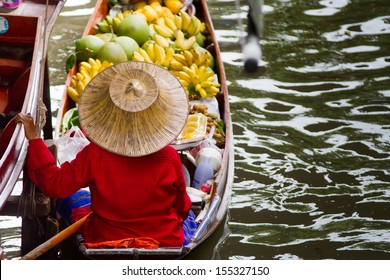 A Woman Selling Fruits At Bangkok Floating Market. 