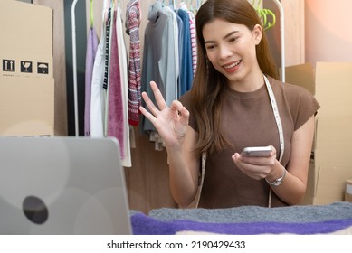 Woman Selling Online Clothing Via Social Media At Home, Take A Photo Of The Clothing With Smartphone Digital Camera For Post To Sell Online, Internet Or Wireless Technology, E-commerce.