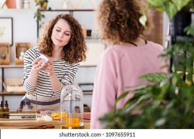 Woman Selling Organic Skincare Products In A Small, Local Shop